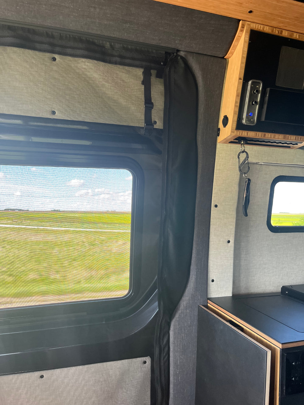 Installed upholstered Mercedes Sprinter C-Pillar trim kit 